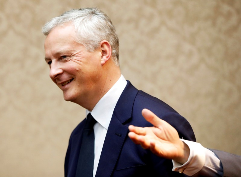 FILE PHOTO: French Finance Minister Bruno Le Maire is escorted by Japanese counterpart Taro Aso