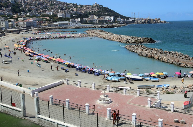 People enjoy the beach of Bab El-Oued in Algiers