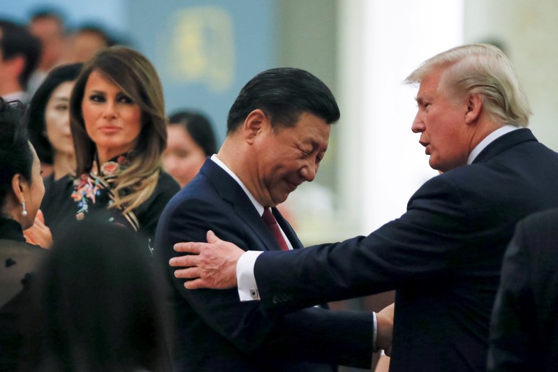 FILE PHOTO: China's President Xi Jinping, first lady Peng Liyuan, U.S. President Donald Trump