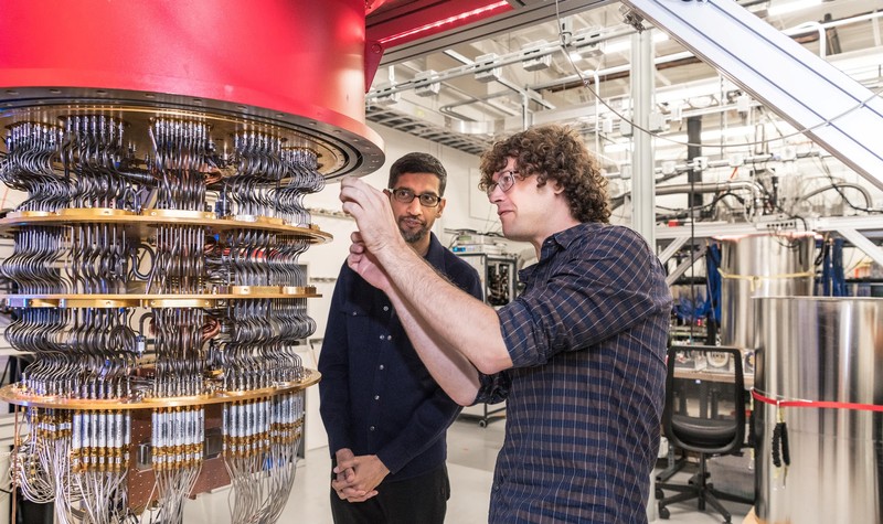 A handout picture shows Pichai and Sank with one of Google's Quantum Computers in the Santa