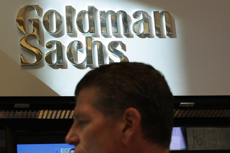 A trader works inside the Goldman Sachs stall on the floor at the New York Stock Exchange