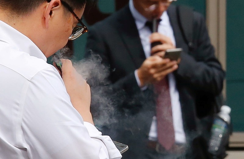 A man vapes in Seoul