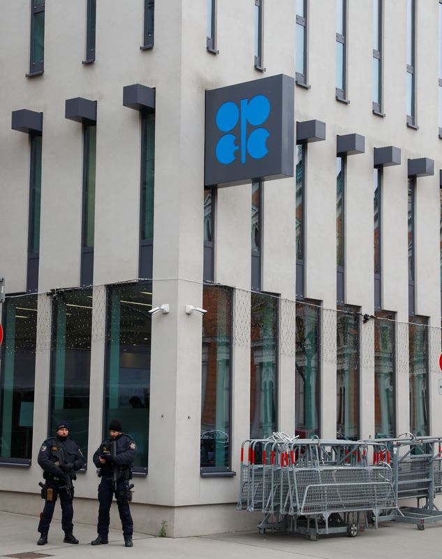 Police officers stand outside the Organisation of the Petroleum Exporting Countries (OPEC)