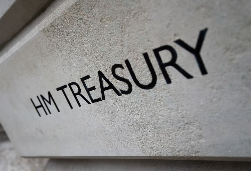 The HM Treasury name is seen painted on the outside of Britain's Treasury building in central