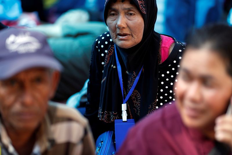 Family members in the fishing industry sit at a protest outside the Agriculture Ministry in