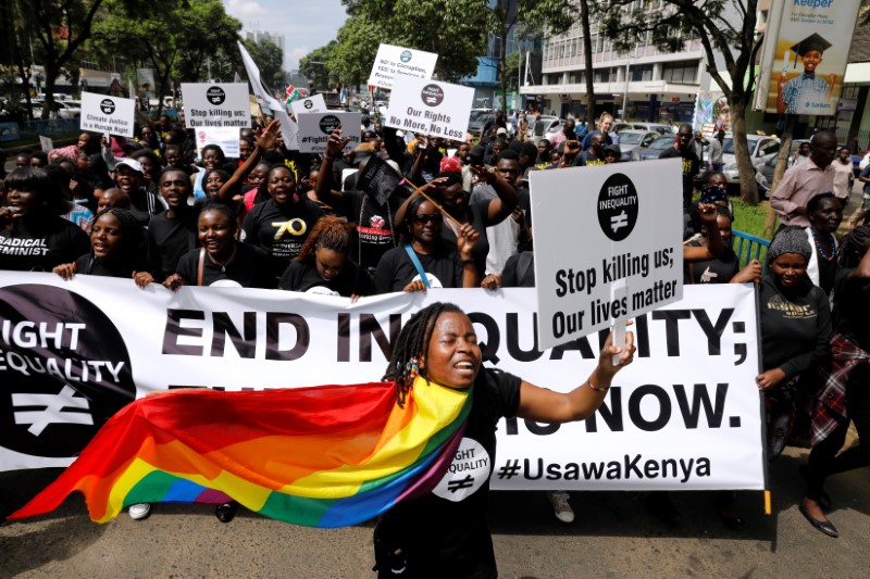 Demonstrators take part in a global protest campaigning against inequality ahead of the Davos