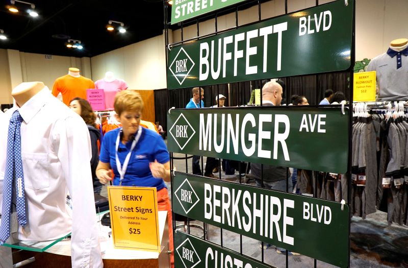 FILE PHOTO: Berkshire Hathaway signs are displayed for sale at the shareholder shopping day in