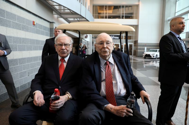 FILE PHOTO: Berkshire Hathaway Chairman Buffett and Vice Chairman Munger wait to begin the