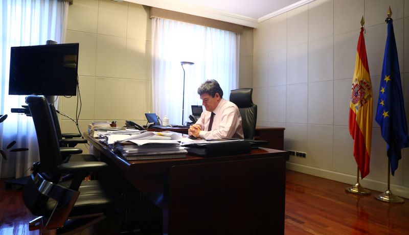 Spain's Social Security Minister, Escriva, gestures during an interview with Reuters at his