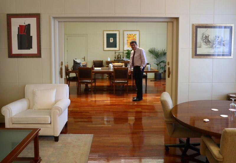 Spain's Social Security Minister, Escriva, stands in his office during an interview with