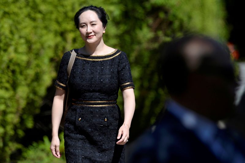 FILE PHOTO: Huawei Technologies Chief Financial Officer Meng Wanzhou leaves her home to attend