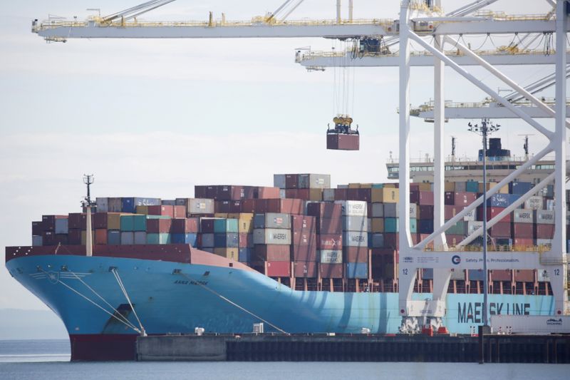 FILE PHOTO: The ship Anna Maersk gets containers unloaded at Roberts Bank port including 69