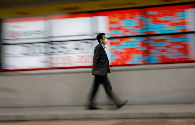 Signage is seen outside the entrance of the London Stock Exchange in London