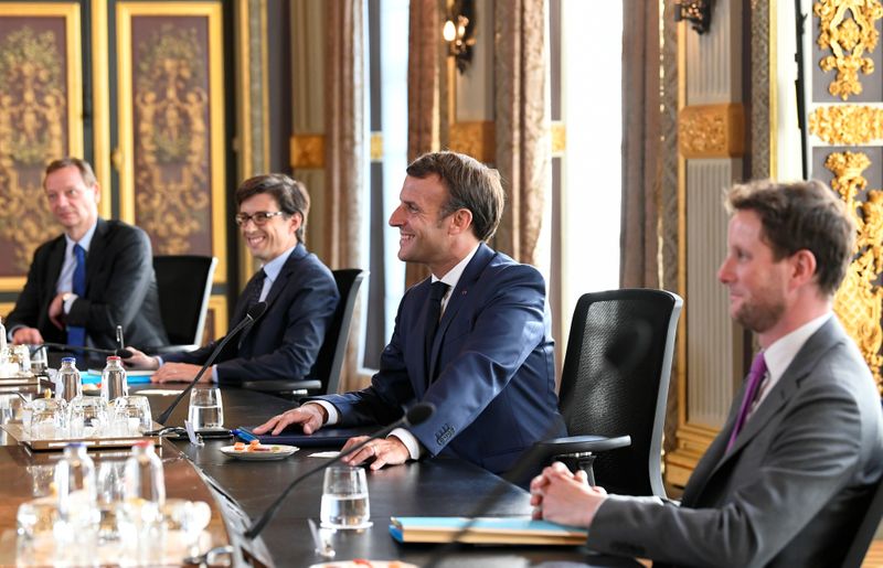 French President Emmanuel Macron reacts as he attends a meeting with Dutch Prime Minister Mark