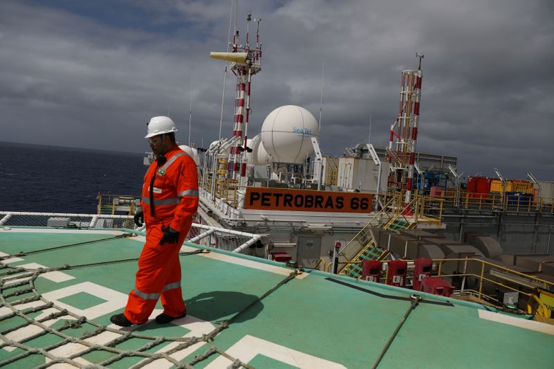 FILE PHOTO: A worker walks on the heliport at the Brazil's Petrobras P-66 oil rig in the