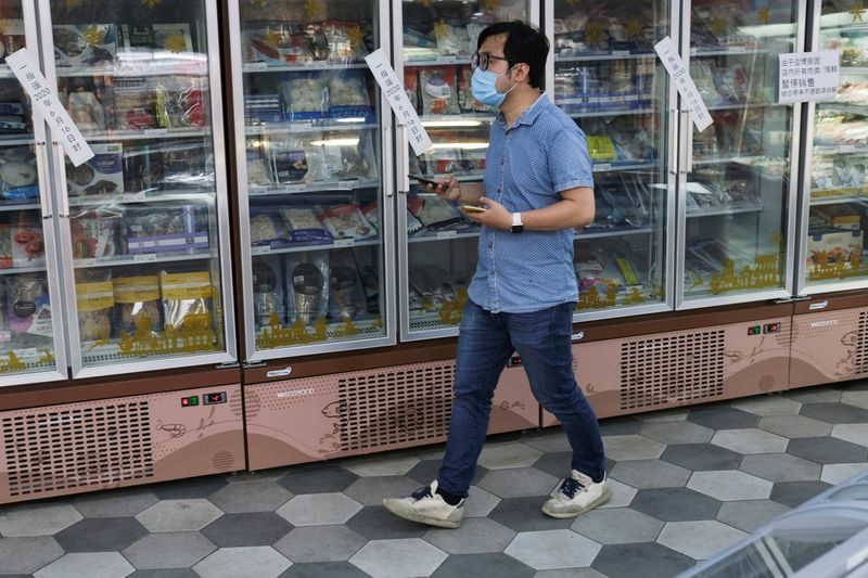 FILE PHOTO: Empty sashimi counter is seen next to live seafood at a supermarket in Beijing