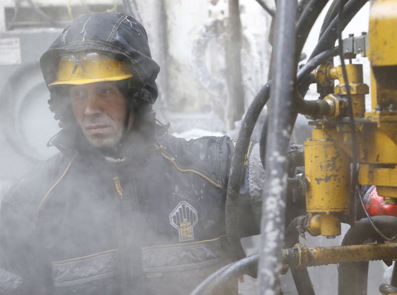 FILE PHOTO: An employee works at a drilling site at the Rosneft company owned Suzunskoye oil