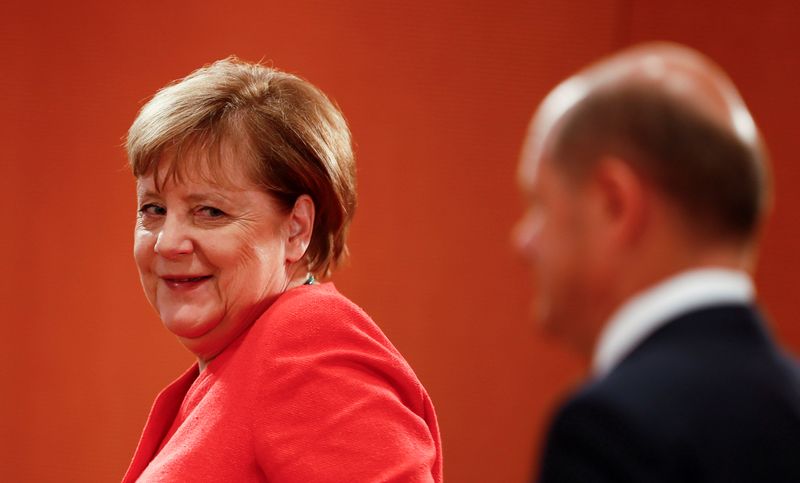 FILE PHOTO: German Finance Minister Olaf Scholz attends a news conference in Berlin